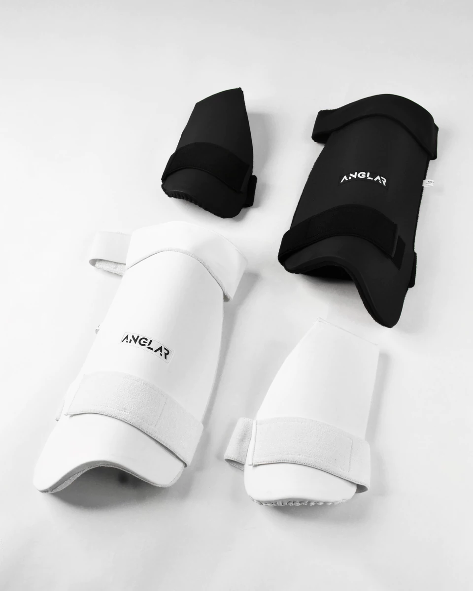 ANGLAR cricket batting pads and thigh guards in black and white